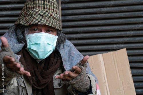 Homeless man wearing a mask during the coronavirus pandemic