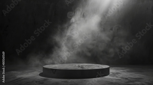 A spotlight shines down on an empty pedestal surrounded by smoke.