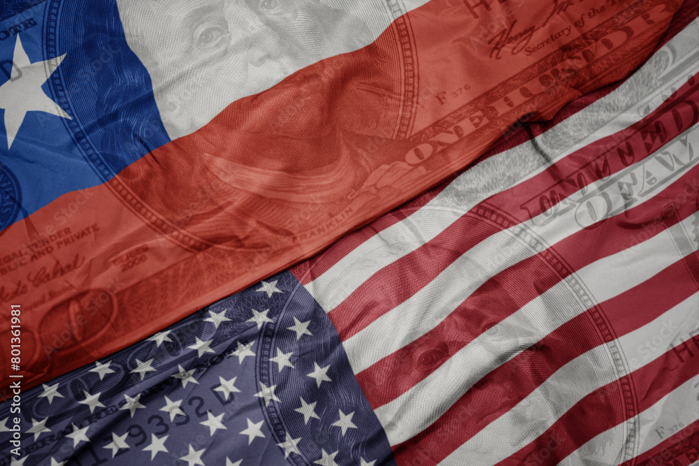 Obraz premium waving colorful flag of united states of america and national flag of chile on the dollar money background. finance concept.