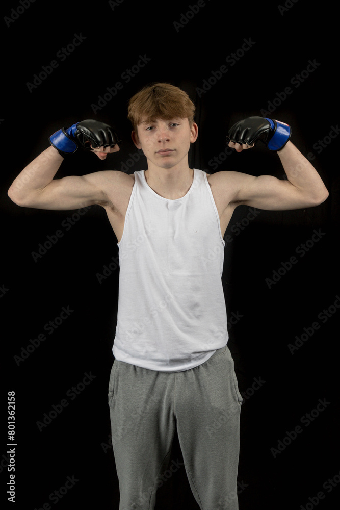 A Teenage Male Boxer and Black Background