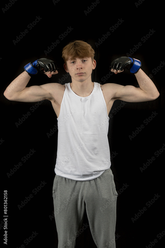 A Teenage Male Boxer and Black Background A Teenage Male Boxer and Black Background