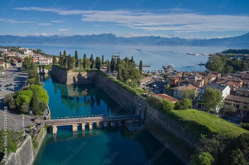 Top view of the town of Peschiera del Garda, the main gate of Porta Brescia located on the shores of Lake Garda. City on the water Italy. The largest lake in Italy. Resorts on Lake Garda Italy.