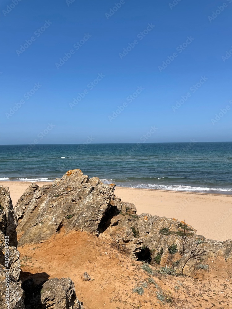 Beach Image Behind The Rocks