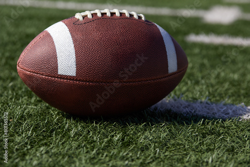 American football ball on field