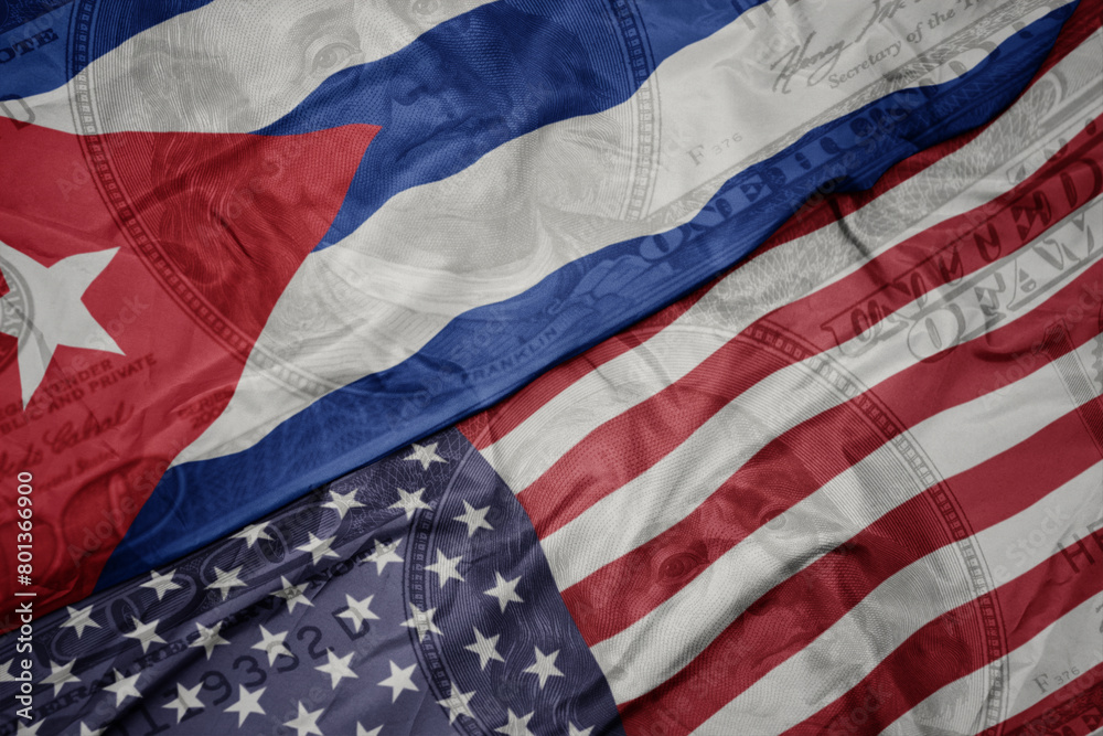 Obraz premium waving colorful flag of united states of america and national flag of cuba.