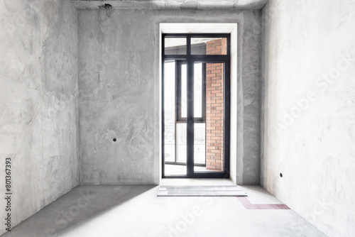 interior of the apartment without decoration in gray colors. rough finish