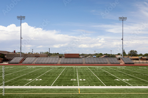 Empty football field and bleachers photo