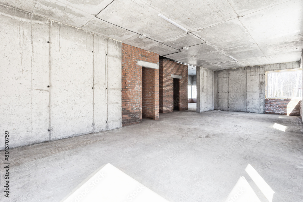 interior of the apartment without decoration in gray colors. rough finish