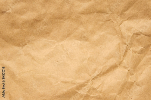Abstract crumpled and creased recycle brown paper texture background © Piman Khrutmuang