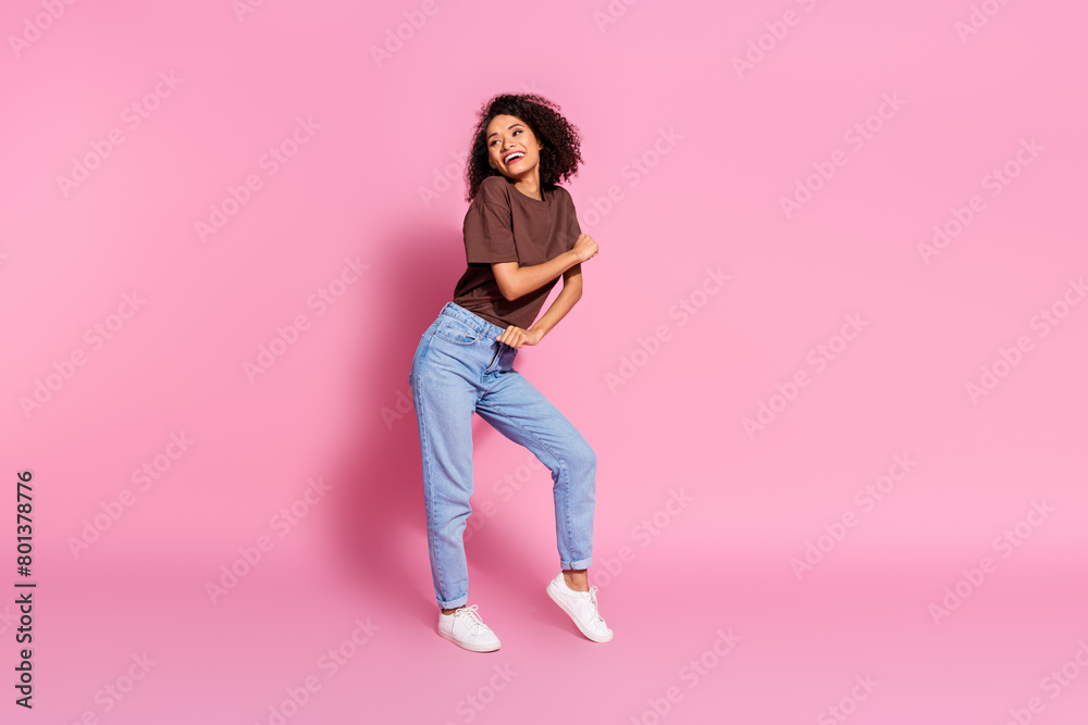 Photo of lovely optimistic active girl wear brown stylish clothes enjoy disco weekend empty space isolated on pink color background Photo of lovely optimistic active girl wear brown stylish clothes enjoy disco weekend empty space isolated on pink color background