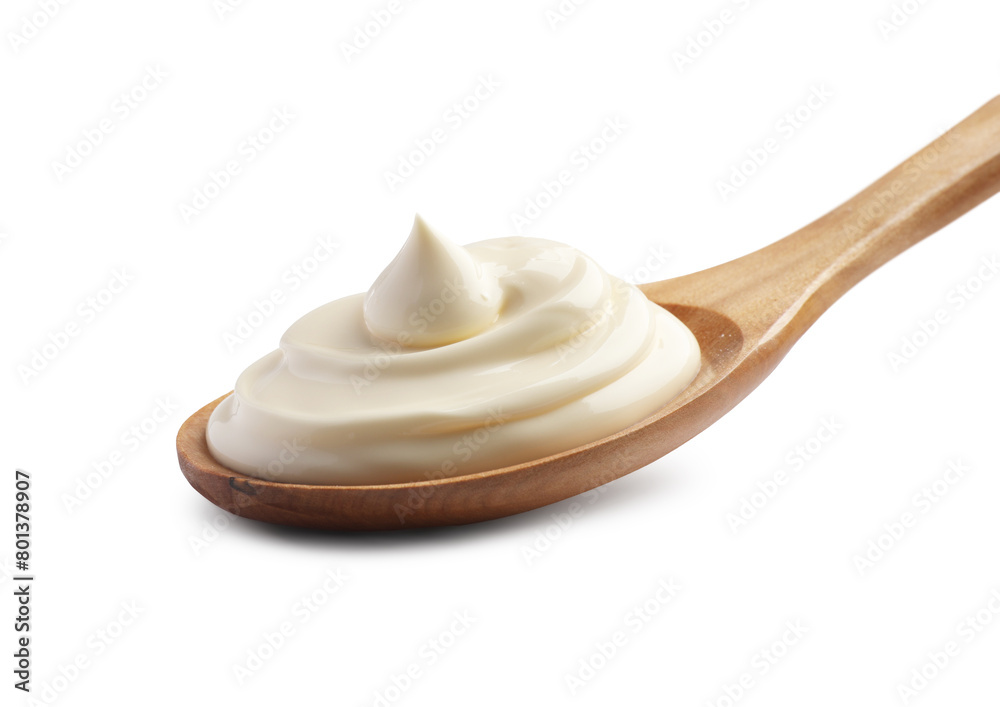 Natural yogurt in wooden spoon isolated on white Natural yogurt in wooden spoon isolated on white
