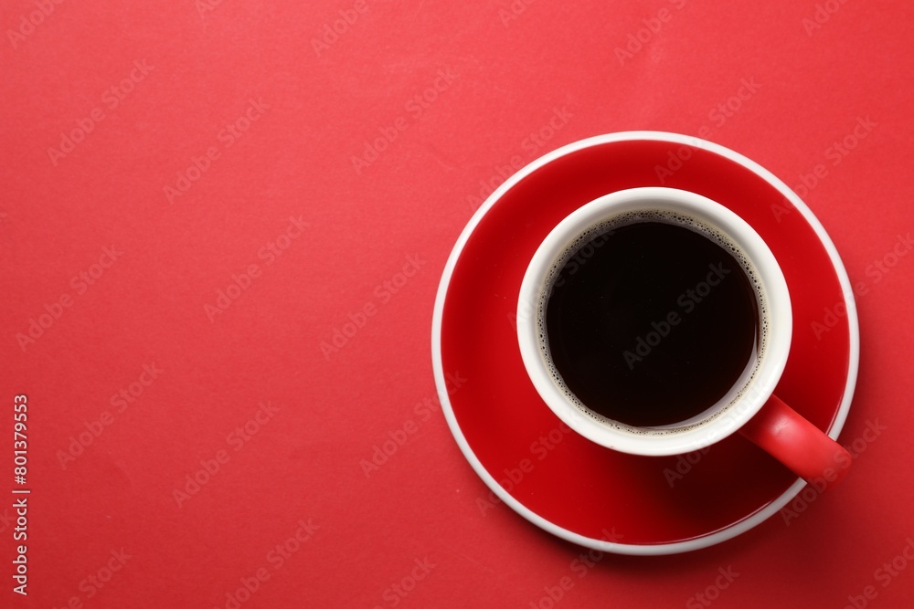 Aromatic coffee in cup on red background, top view. Space for text Aromatic coffee in cup on red background, top view. Space for text