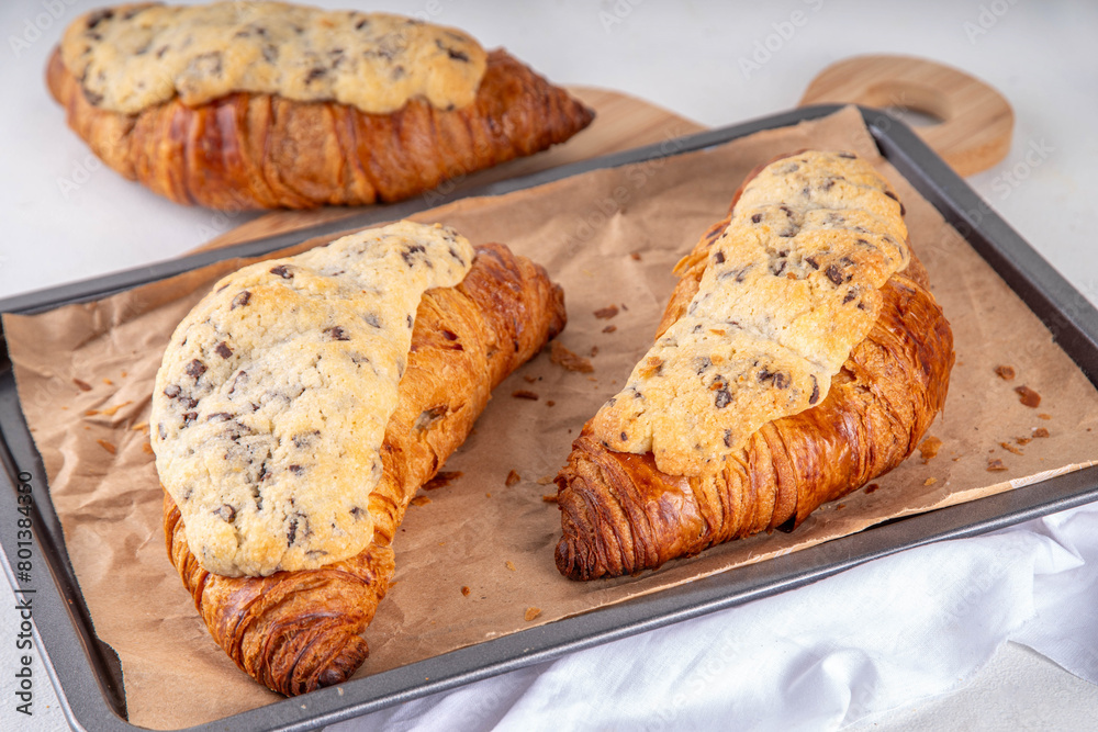 Trendy French sweet dessert pastry crookie, a hybrid of croissant with sweet butter cookies with chocolate drops dough baked filling and glaze Cookie Croissant (Le Crookie) Viral Recipe