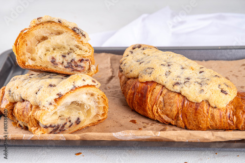 Trendy French sweet dessert pastry crookie, a hybrid of croissant with sweet butter cookies with chocolate drops dough baked filling and glaze Cookie Croissant (Le Crookie) Viral Recipe