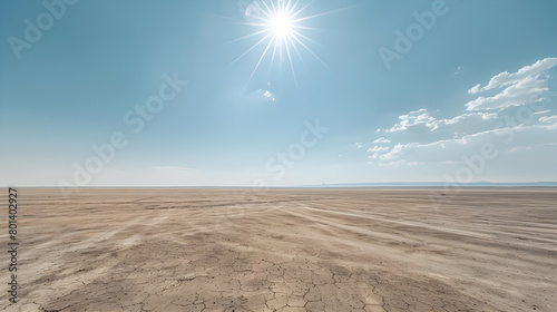 A wide, barren open space overlooking the sky and the hot sun during the day.