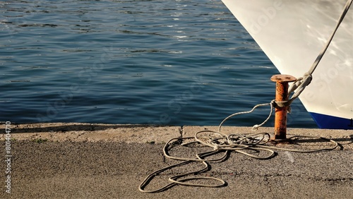 metal mooring with rope and keel in port photo