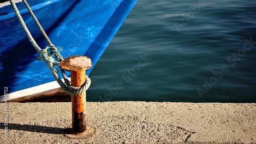 metal mooring with rope and keel in port