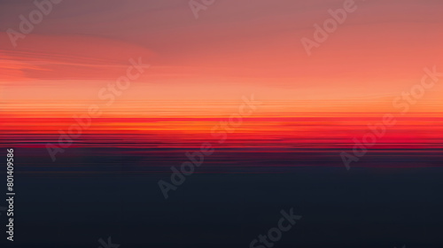 A linear abstraction of a sunset  with warm hues blending into cool tones in a gradient that spans the width of the screen. 
