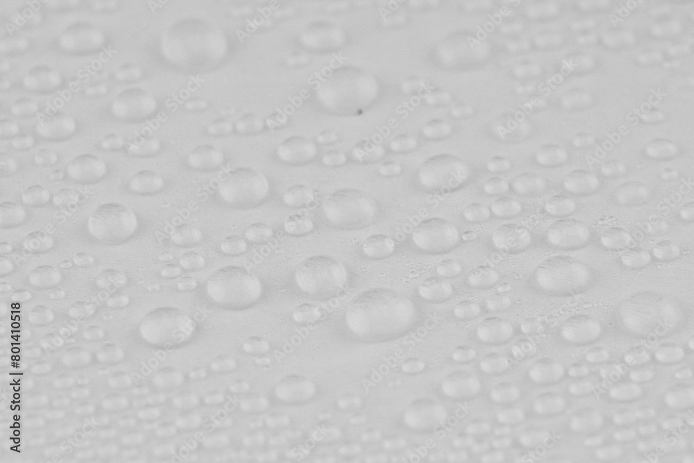 Water drops texture background. Shiny water drops on white surface.
