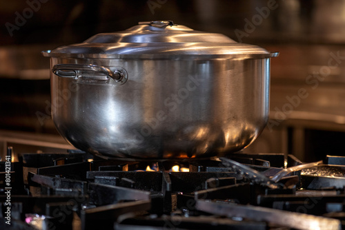 Big Cook pot on gas stove. preparing food in kitchen.