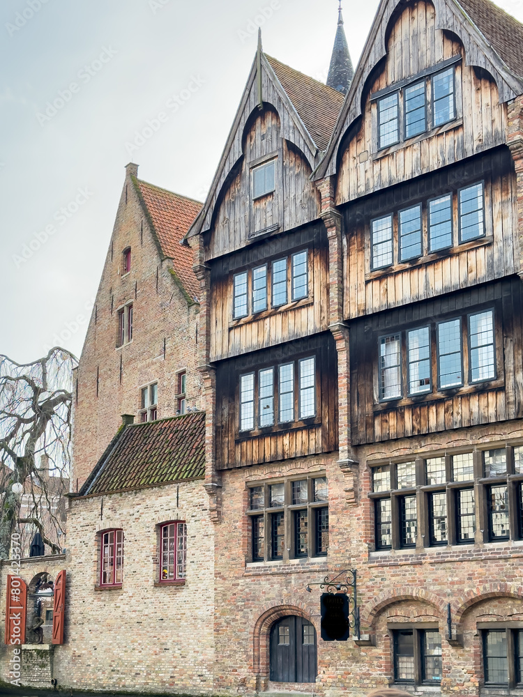 Fototapeta premium Street view of the famous touristic city of Belgium, Bruge, and its houses with classical medieval architecture