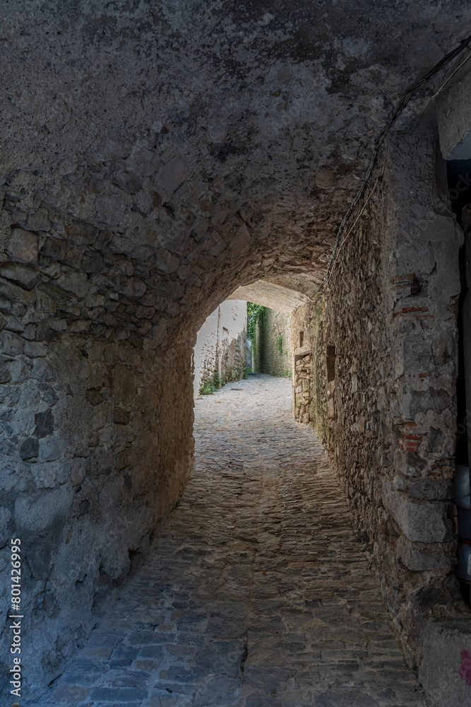 Sauve, France - 04 16 2024: Panoramic View of a typical white Occitan stone passage of the Village on the hill .