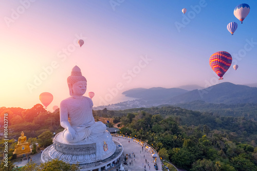 Aerial view Big Buddha statue with balloons on Phuket Thailand sunset light by drone