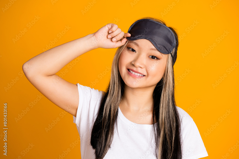 Photo of cheerful pretty cute woman wear white trendy pajama preparing sleep isolated on yellow color background Photo of cheerful pretty cute woman wear white trendy pajama preparing sleep isolated on yellow color background