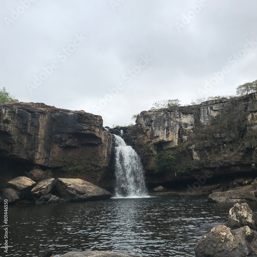 waterfall among the rocks and vegetation in Conceição do Mato Dentro, state of Minas Gerais, Brazil. This shows the beautiful Brazilian and Latin American nature.