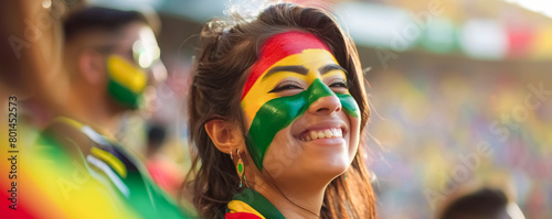 Happy Bolivian female supporter with face painted in Bolivian flag colors, Bolivian fan at a sports event such as football, soccer or rugby match, blurry stadium background 