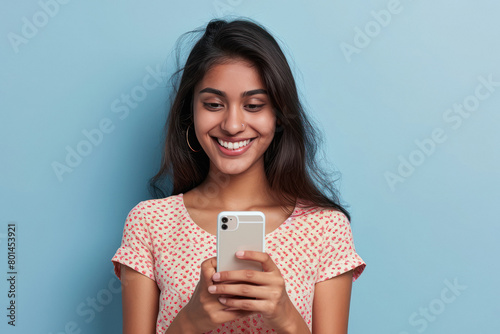 Young indian woman using smartphone photo