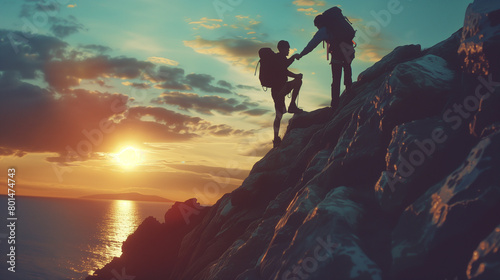 couple of hikers with backpacks on the top of a mountain at sunset
