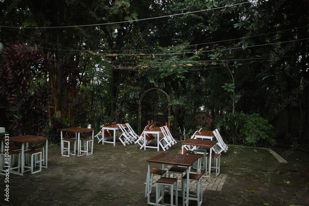 Decorative table and chairs in empty outdoor cafe