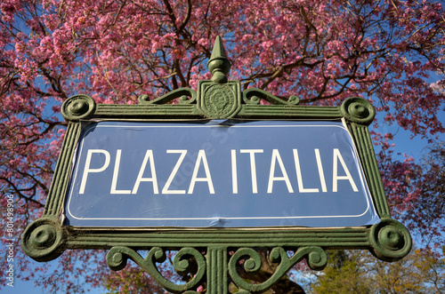Sign for Buenos Aires landmark Plaza Italia square with pink blooming tree