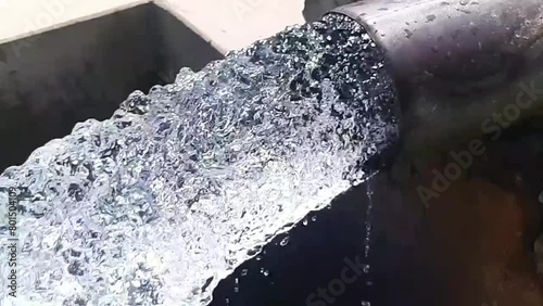 Tube Well Water. Water is coming out from a Tube Well. Irrigation water flow from pipe for agriculture fields. slow motion water flash. Beautiful 4k footage.