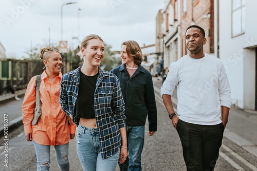 Cheerful diverse friends walking in the city © Rawpixel.com