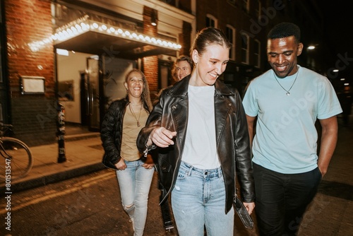 Diverse friends going out at night