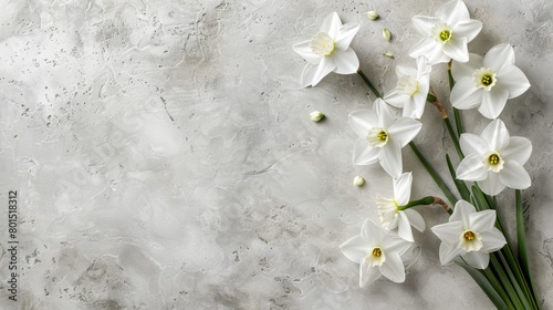  A marbled surface bears several bunches of white daffodils, their stems emerging green from the midst