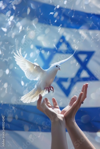 A man s hand reaches out to a white dove against the background of the sky and the waving Israeli flag
