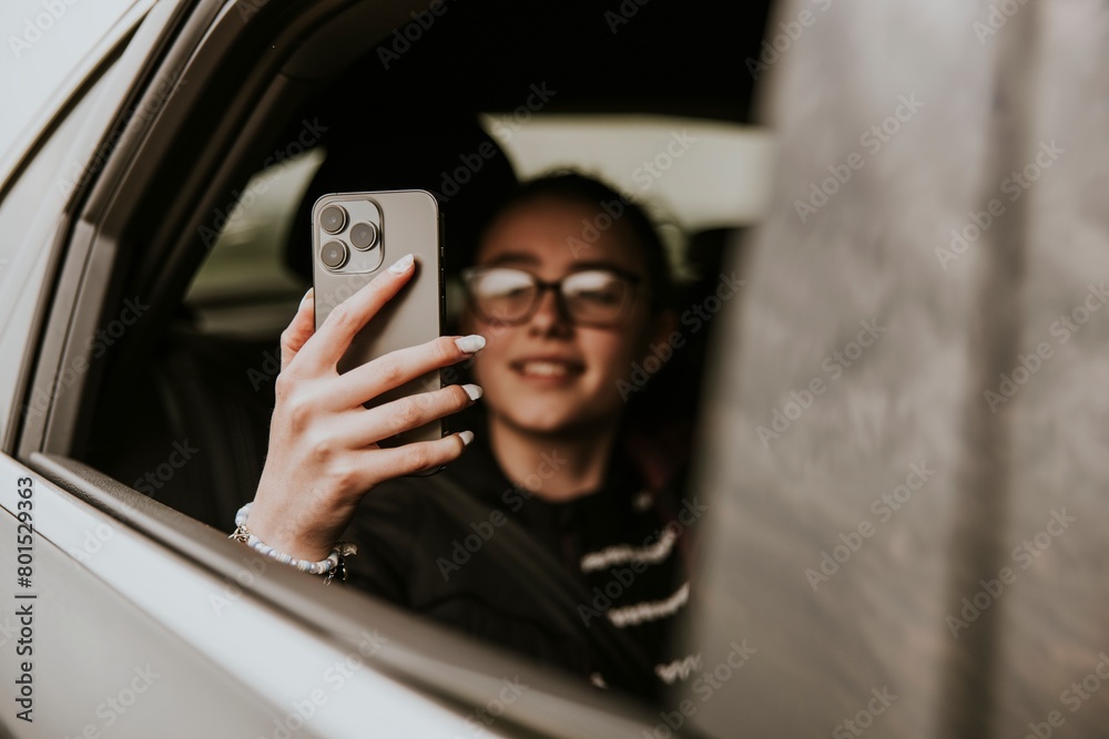 Girl taking photo with phone on road trip photo Girl taking photo with phone on road trip photo