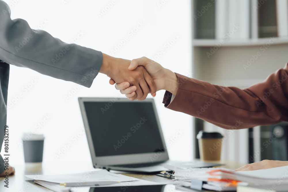 Two young Asian business woman talk, consult, discuss working with new startup project idea presentation analyze plan marketing and investment in the office. Two young Asian business woman talk, consult, discuss working with new startup project idea presentation analyze plan marketing and investment in the office.