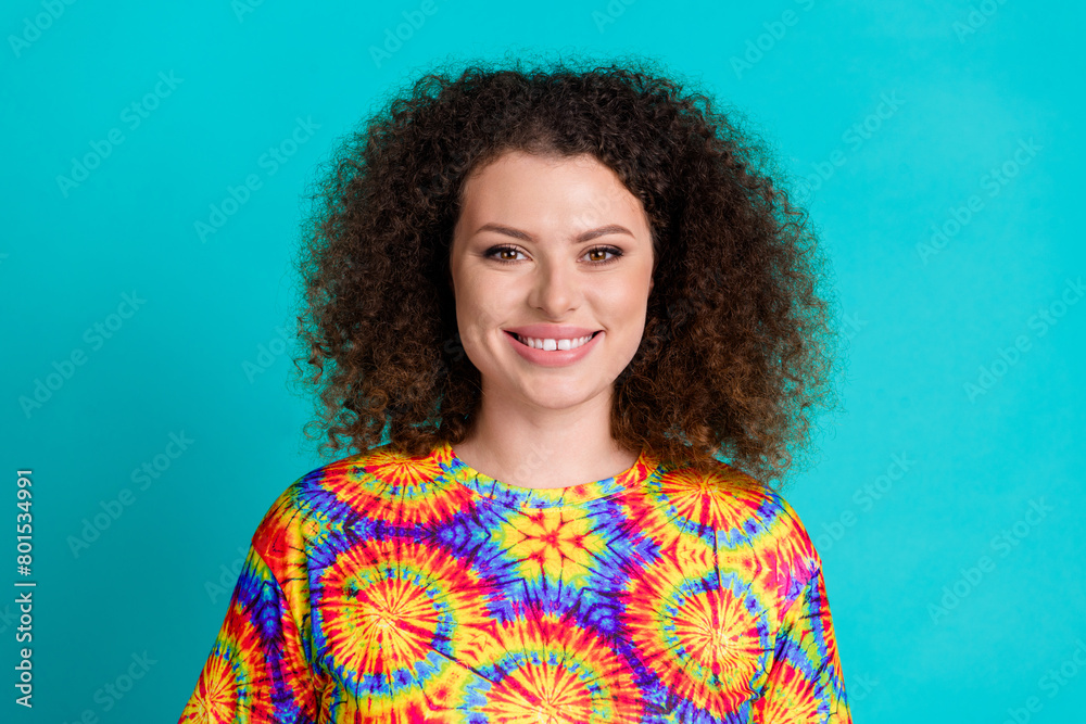 Photo of lovely cute pretty girl wear trendy vivid print clothes isolated on cyan color background Photo of lovely cute pretty girl wear trendy vivid print clothes isolated on cyan color background