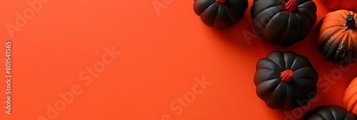 a group of pumpkins sitting on top of bright orange background