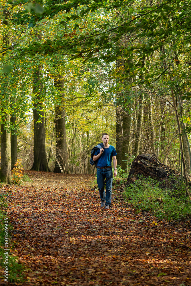 Man walking alone in the Laerbeek woods, Jette, Belgium Man walking alone in the Laerbeek woods, Jette, Belgium