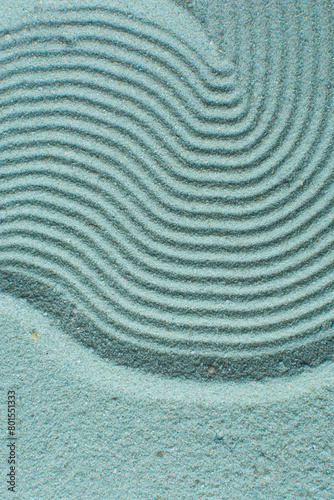 textured blue sand background, beautiful sand texture, overhead view of blue sand, zen pattern drawn in the sand, Top view of fine grain texture