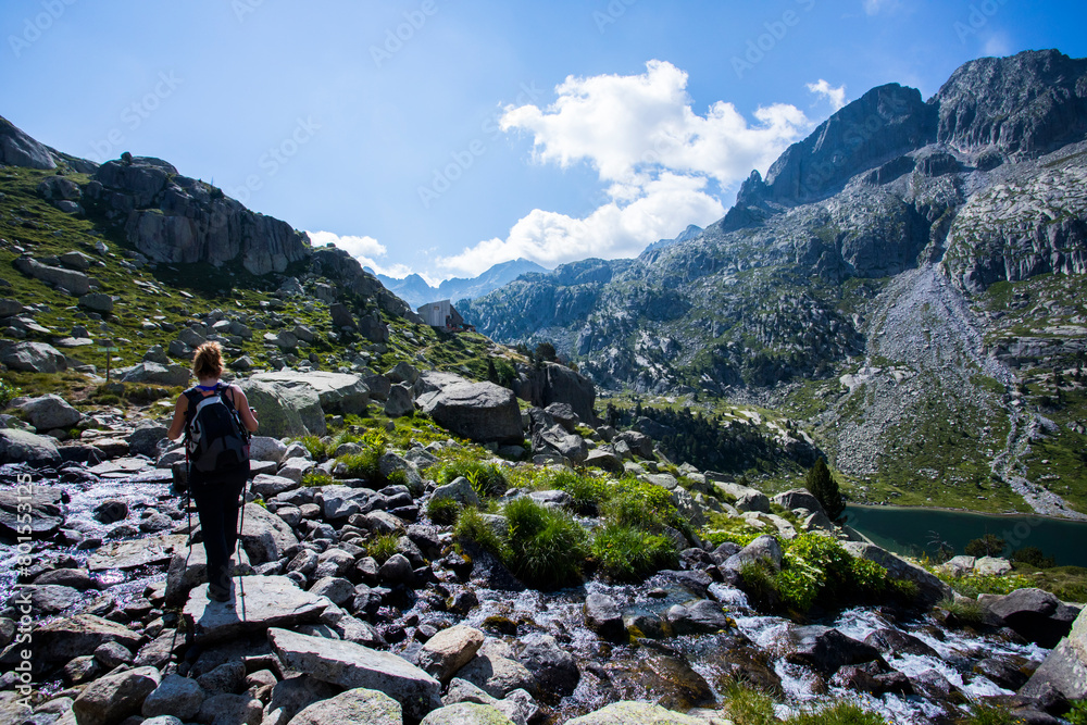 Young hiker woman in Vall de Boi, Aiguestortes and Sant Maurici National Park, Spain