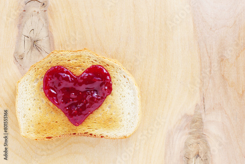 Toast with jam in the shape of a heart