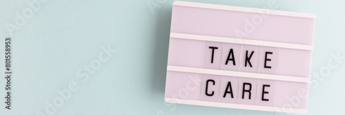Take care. Banner with lightbox on a blue background. Place for text.