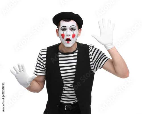 Mime artist making shocked face on white background