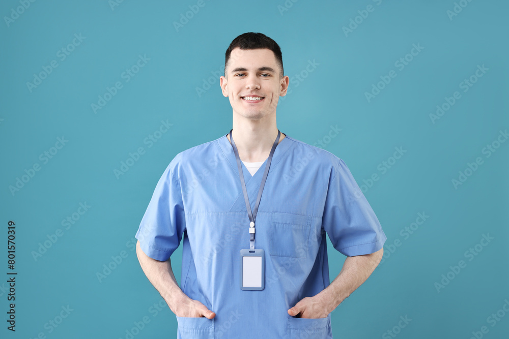Portrait of smiling medical assistant on light blue background Portrait of smiling medical assistant on light blue background